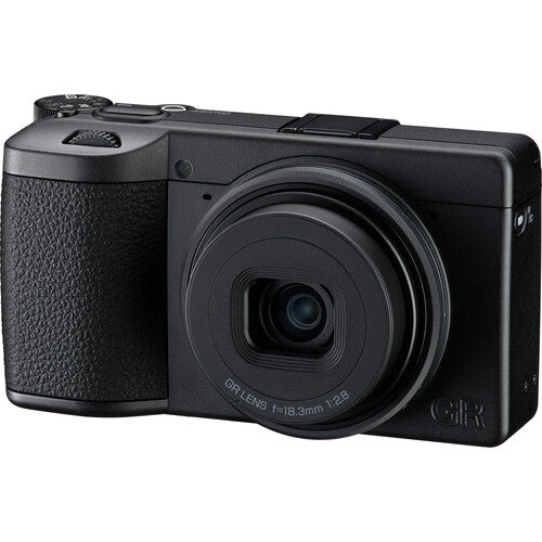 Black camera with a prominent lens on a white background