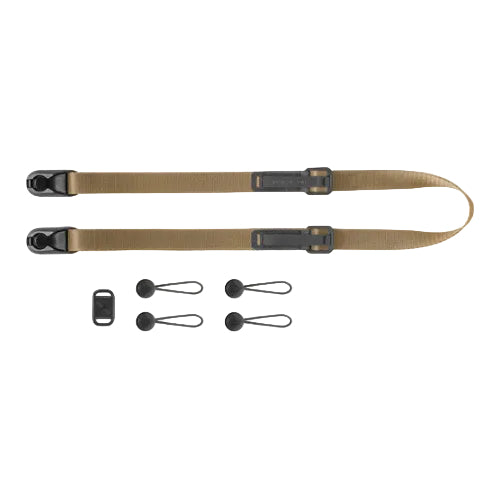 Two brown rifle slings with black hardware on a white background