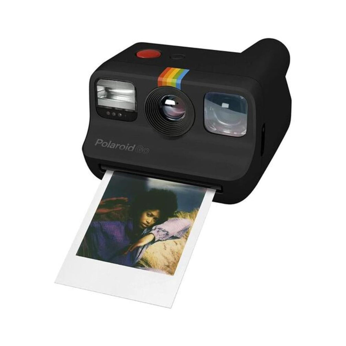 Compact black Polaroid Go instant camera with a red shutter button and a developing color photo print.