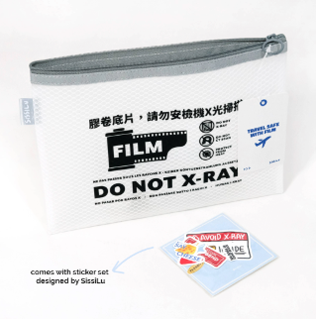 A white zip bag with text and icons indicating it should not be X-rayed, along with a set of film-themed stickers designed by Sissi Lu.