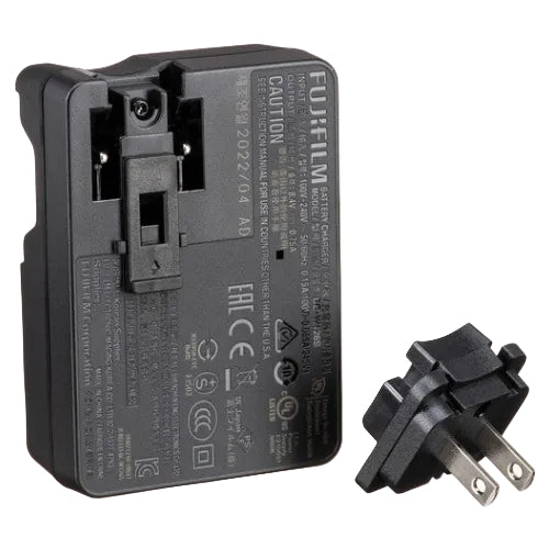Black Fujifilm battery charger with plug on a white background