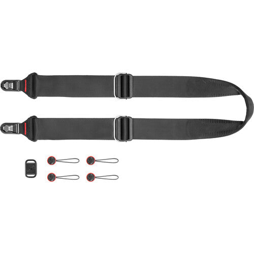 Black camera strap with quick-release clasp and additional attachments on a white background