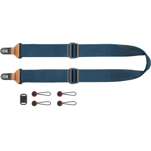 Blue camera strap with accessories on a white background