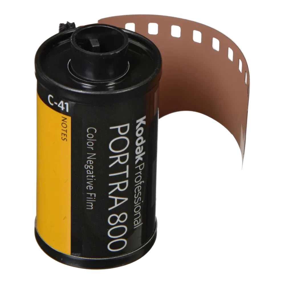 Black and yellow film canister with film edge coming out and text printed on the side on a white background