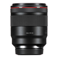 Camera lens with black and red design on a white background