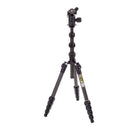 A matte black carbon fiber tripod with twist locks and a ball head set, folded to a compact size.