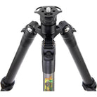 Close-up of a tripod leg assembly with black metal tubes, adjustment knobs, and a central column featuring a colorful cartoon graphic near the bottom, shown on a white background.