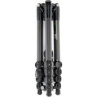 A black and dark gray folded tripod photographed on a plain white studio background.