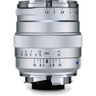 Silver camera lens with focus and aperture scale on a white background