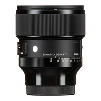A Sigma 85mm f/1.4 DG DN φ77mm camera lens in matte black, shown from a front three-quarter angle against a solid white background.