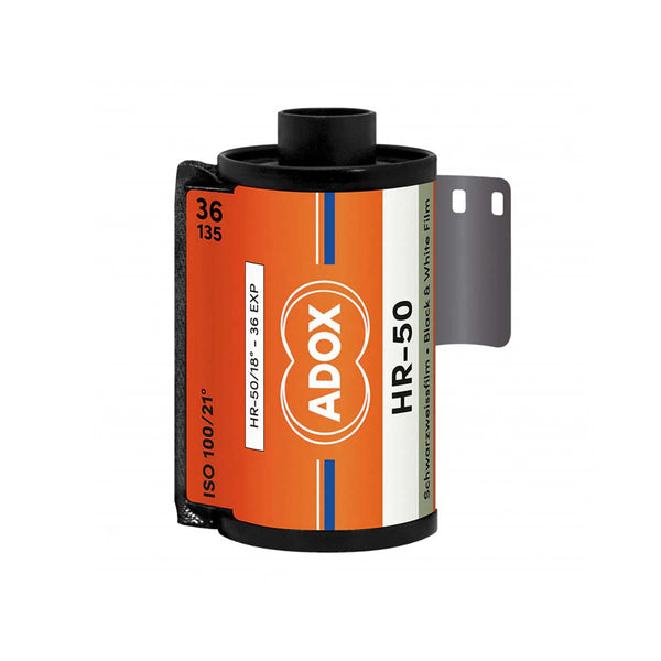 A roll of ADOX HR-50 film, showing the orange, white, and black label with the brand logo, on a solid white background.