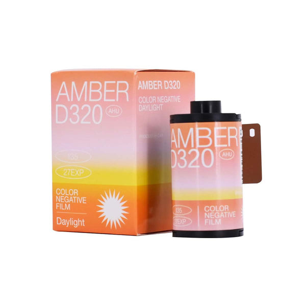 Amber D320 35mm color negative film roll and orange gradient box with 27 exposures and daylight-balanced branding.