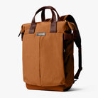 Brown backpack with leather straps on a white background
