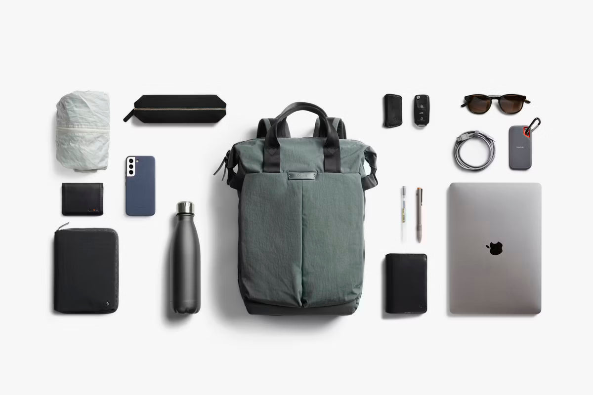Collection of everyday items that fit into a Bellroy Totepack 20L with a white background