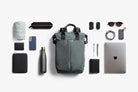 Collection of everyday items that fit into a Bellroy Totepack 20L with a white background