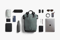 Collection of everyday items that fit into a Bellroy Totepack 20L with a white background