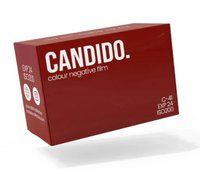 A red box of Candid. colour negative film, shown at an angle on a white background with a soft shadow underneath.