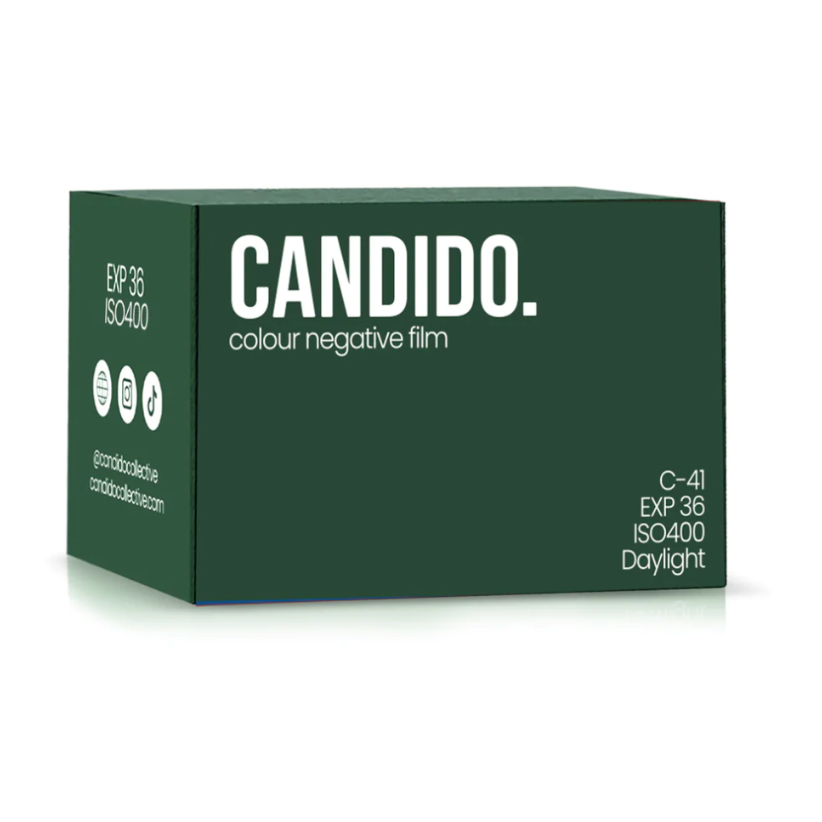 A dark green box of Candid. colour negative film, shown at a three-quarter angle on a white background with a soft reflection.