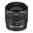 A black Canon RF 35mm f/1.8 Macro IS STM lens with focus and zoom rings clearly visible.