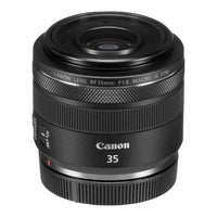 A black Canon RF 35mm f/1.8 Macro IS STM lens with focus and zoom rings clearly visible.