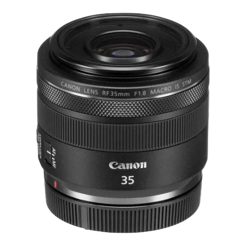 A black Canon RF 35mm f/1.8 Macro IS STM lens with focus and zoom rings clearly visible.