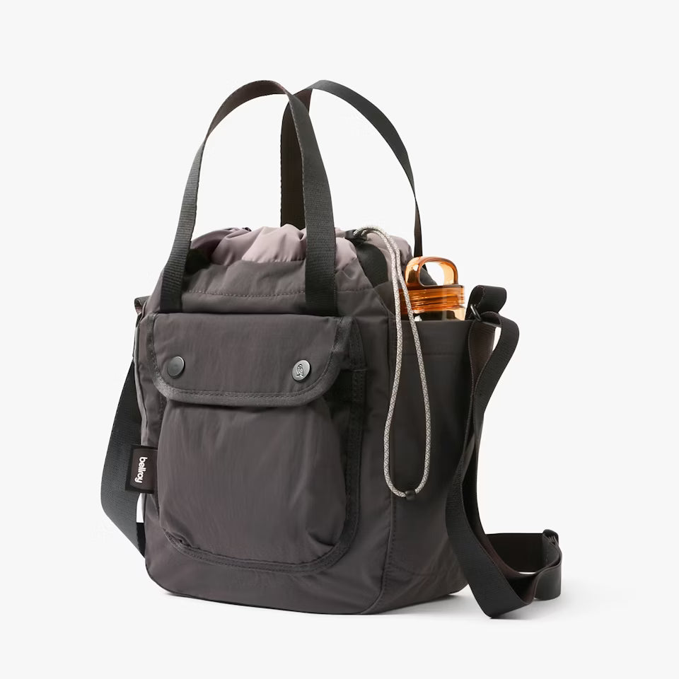 Gray backpack with a water bottle on a white background
