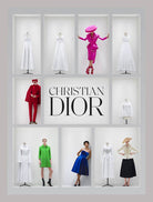 Display of Christian Dior fashion with mannequins wearing various outfits.