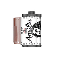 A 36-exposure film canister labeled 'Amalia' with a partially exposed brown film strip, shown on a plain white background.