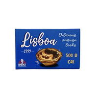 A rectangular blue package labeled 'Lisboa' with a vintage-style illustration of a pastry in the center and text reading 'Delicious vintage looks', '1999', '500 D', and 'C41'. The Cinepot logo appears in the lower left corner.