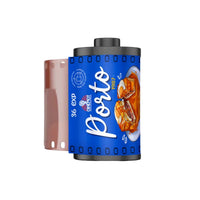 A single Porté 1937 film roll shown on a plain white background, with the blue label facing forward and a strip of pink-toned film visible behind it.