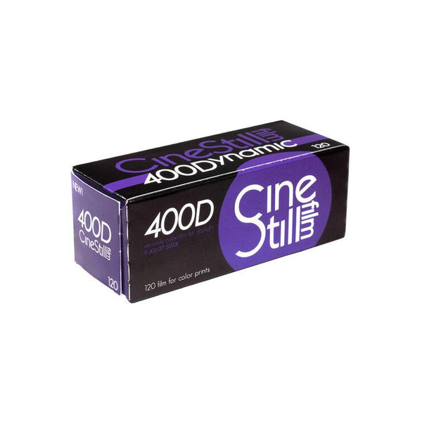 Single roll of CineStill 400Dynamic 120 color negative film in a black and purple cardboard box.
