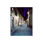 Narrow cobblestone alley at night with signature CineStill 800T tungsten-balanced blue tones and glowing streetlights.