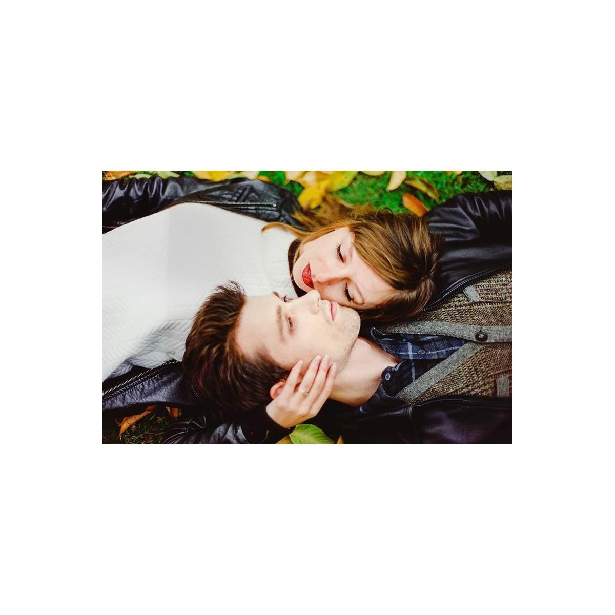 Couple lying on grass in a cinematic shot with rich colors and soft highlights captured on CineStill 800T film.
