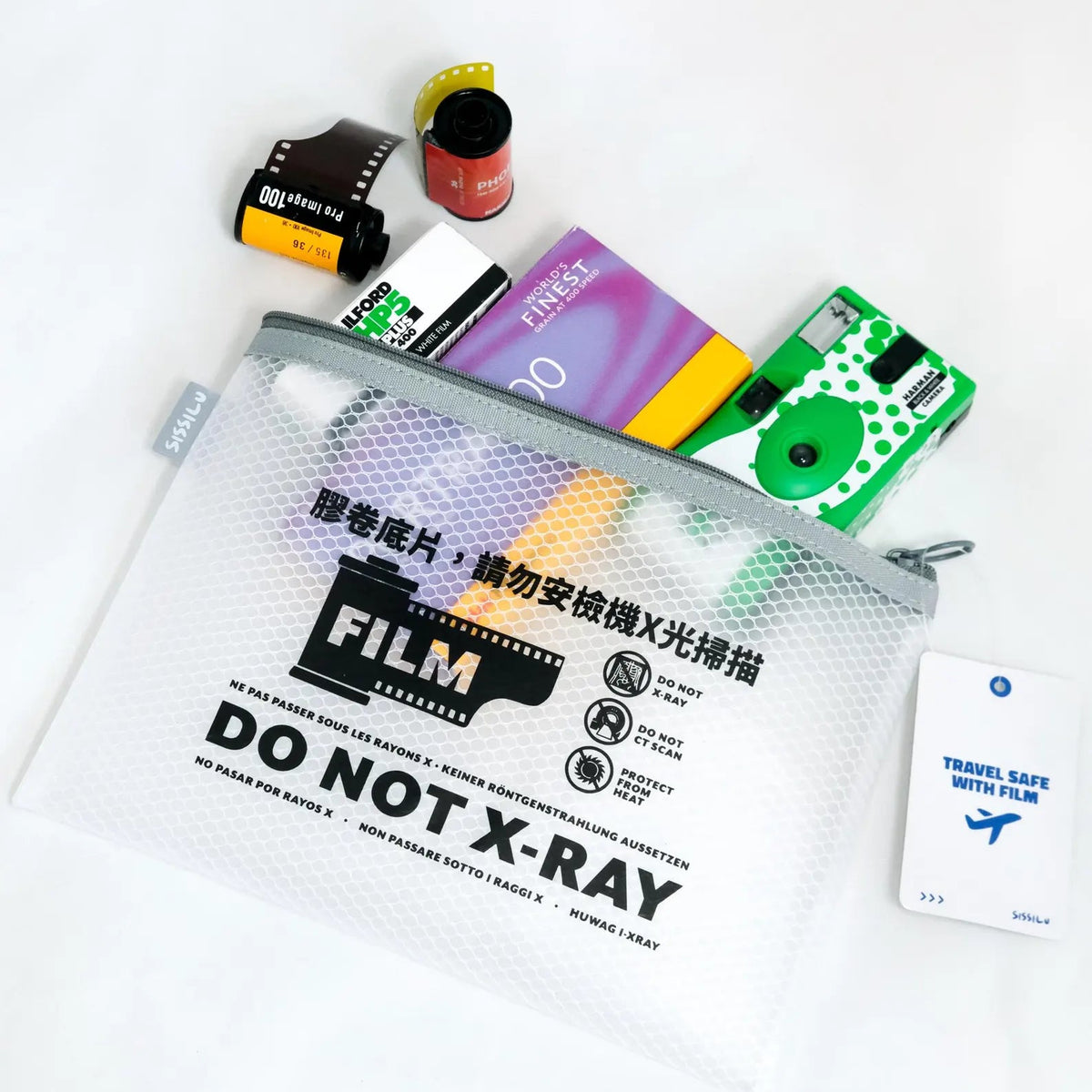 Film packaging with 'Do Not X-Ray' label and other items on a white background