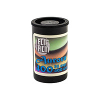 FLIC Film Aurora 400 ISO 35mm color negative film in a black metal cassette with a vibrant aurora-themed label.
