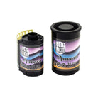 Two rolls of FLIC Film Aurora 800 ISO 35mm color negative film with black canisters and purple aurora-themed labels.