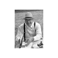 Black and white portrait of a man in a straw hat and suspenders, captured with FPP Derev Pan 400 35mm film.