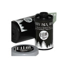 Two rolls of FPP Derev Pan 400 35mm black and white film with a grey plastic cap on a white background.