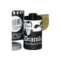FPP Dracula 64 ISO 35mm black and white film canister with a vampire illustration and exposed film leader.