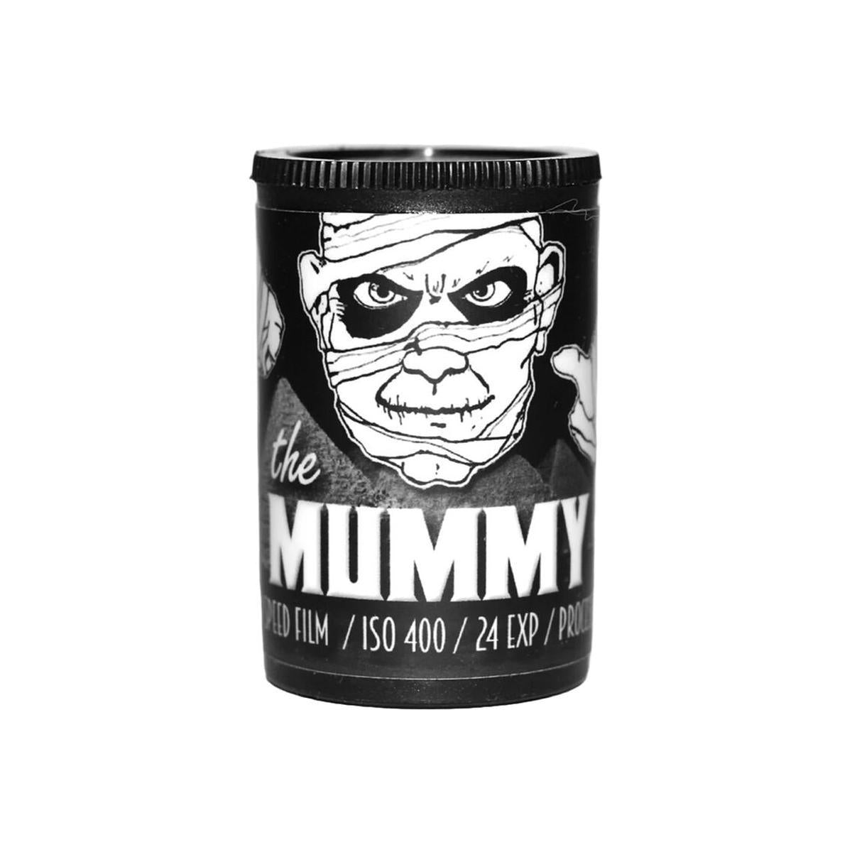 Black and white 35mm film canister featuring a mummy illustration, ISO 400, 24 exposures, and bold text branding.