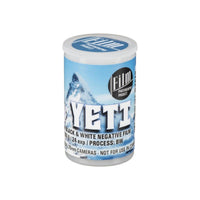 FPP Yeti 6 ISO 35mm black and white film canister with blue mountain graphic label and white plastic cap.