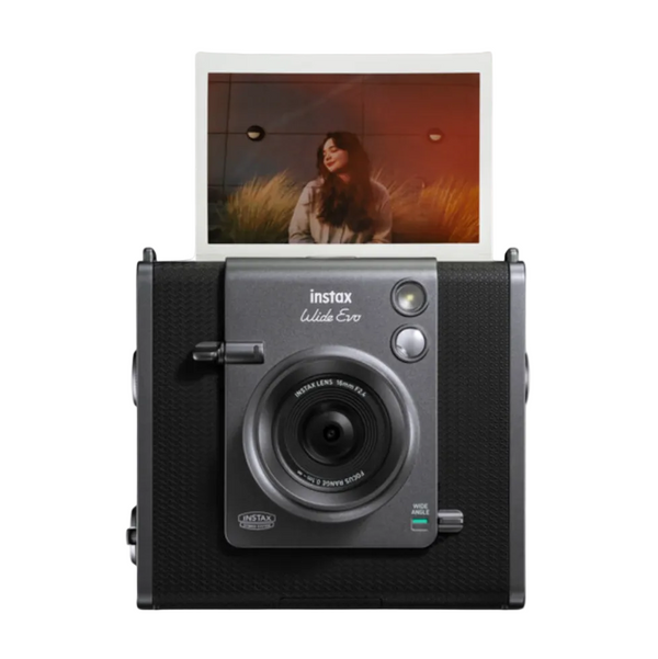 A black FUJIFILM INSTAX WIDE EVO Hybrid Instant Film Camera with an instant film insert on the top showing a captured photo, along with a 3.5 inch LCD screen and control buttons visible.
