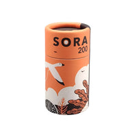 FilmNeverDie SORA 200 35mm film in a cylindrical orange cardboard canister with bird and cloud illustrations.