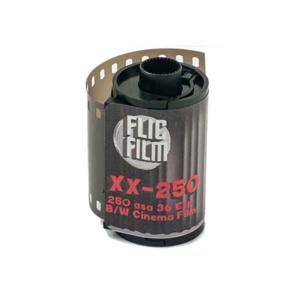 A roll of FLIC Film XX-250 35mm B/W Cinema Film on a white background.