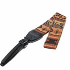 A camera strap with a multicolored pattern and black leather ends.
