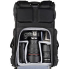 Black camera backpack with Canon camera and lenses inside on a white background