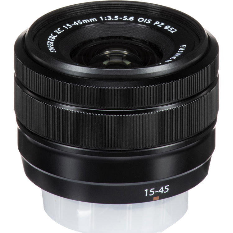 A black Fujifilm SuperEtc VC 15-45mm lens with white text markings, shown on a clean white background.