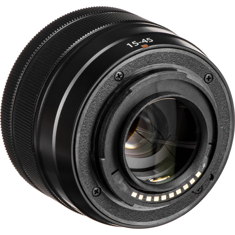 A close-up studio shot of a black camera lens with '15-45' printed in white on the front, set against a plain white background.