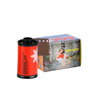 A film canister of Grafx Sparkler 400 film stands in front of its retail box on a clean light gray background. The canister is bright red with black top and bottom rims and white vertical text reading 'SPARKLER 400'.