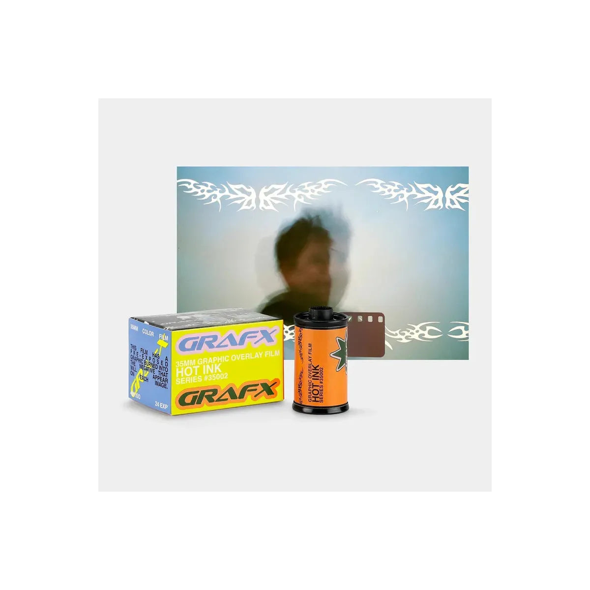 A Grafx hot ink film product display featuring a yellow and blue 25mm film box, an orange film roll, and a brown film strip in front of a blurred demonstration photo with white graphic overlays.